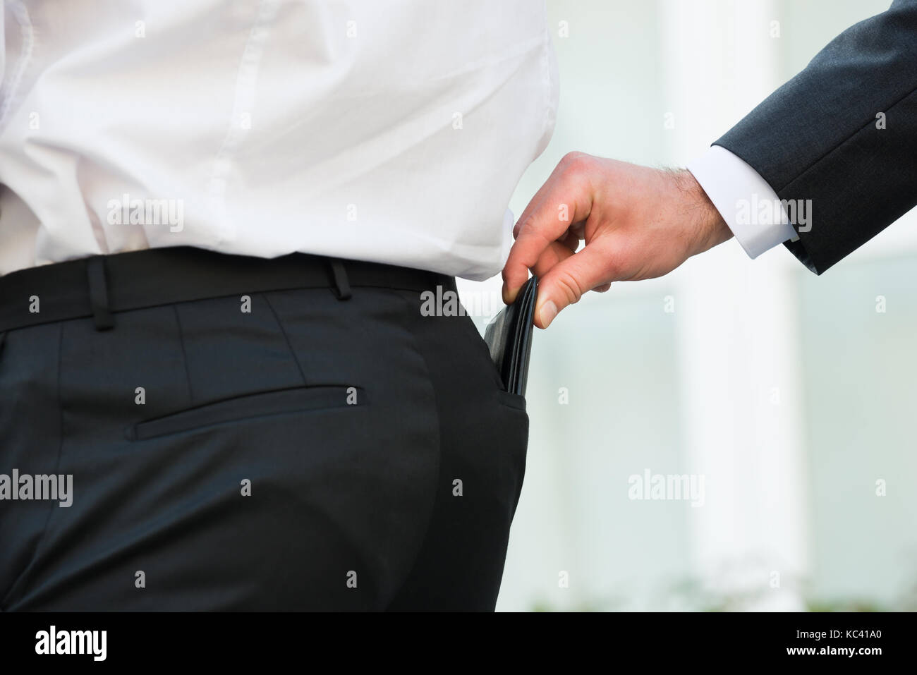 La main coupée de portefeuille à la tire Banque D'Images