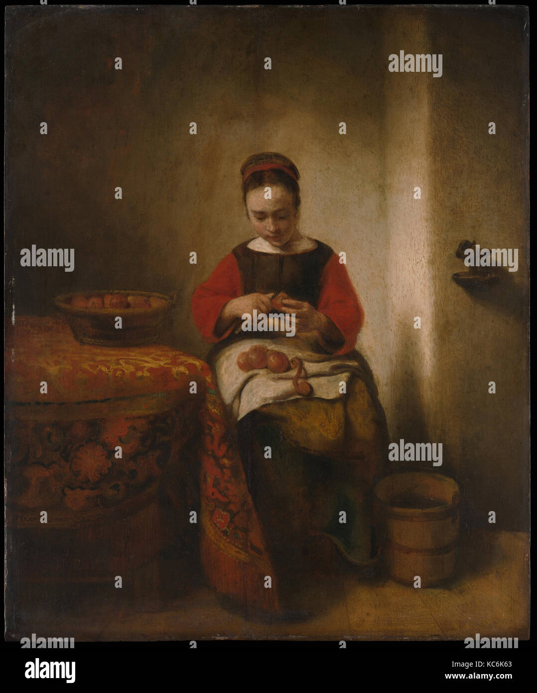 Young Woman Peeling Apples, Nicolaes MAES, ca. 1655 Banque D'Images