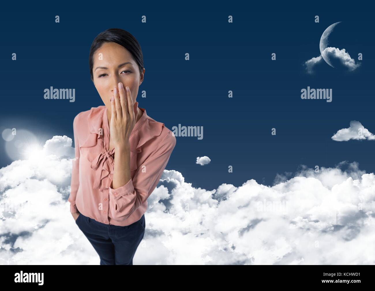 Digital composite of Woman yawning dans les nuages avec lune Banque D'Images