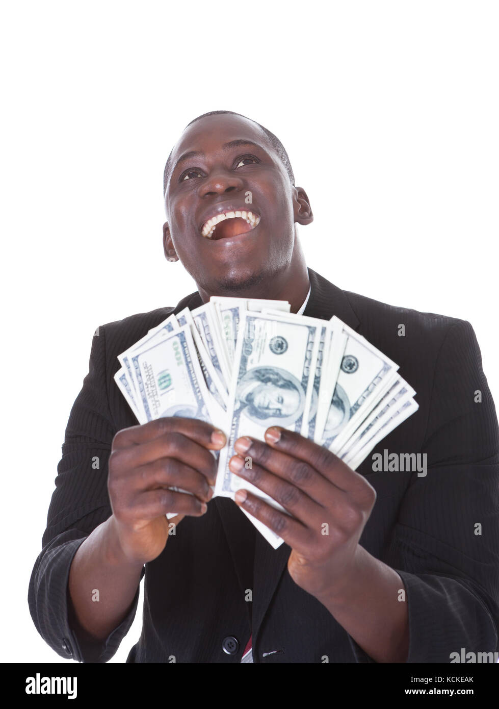 Young African businessman holding jusqu'à des billets Banque D'Images