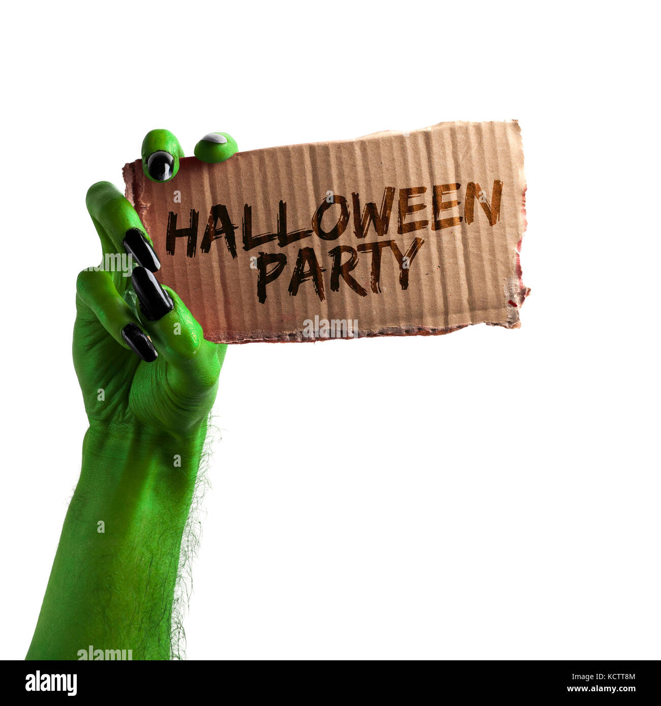 Halloween party. vert sorcières ou monstre zombie hand holding a sign carte Banque D'Images