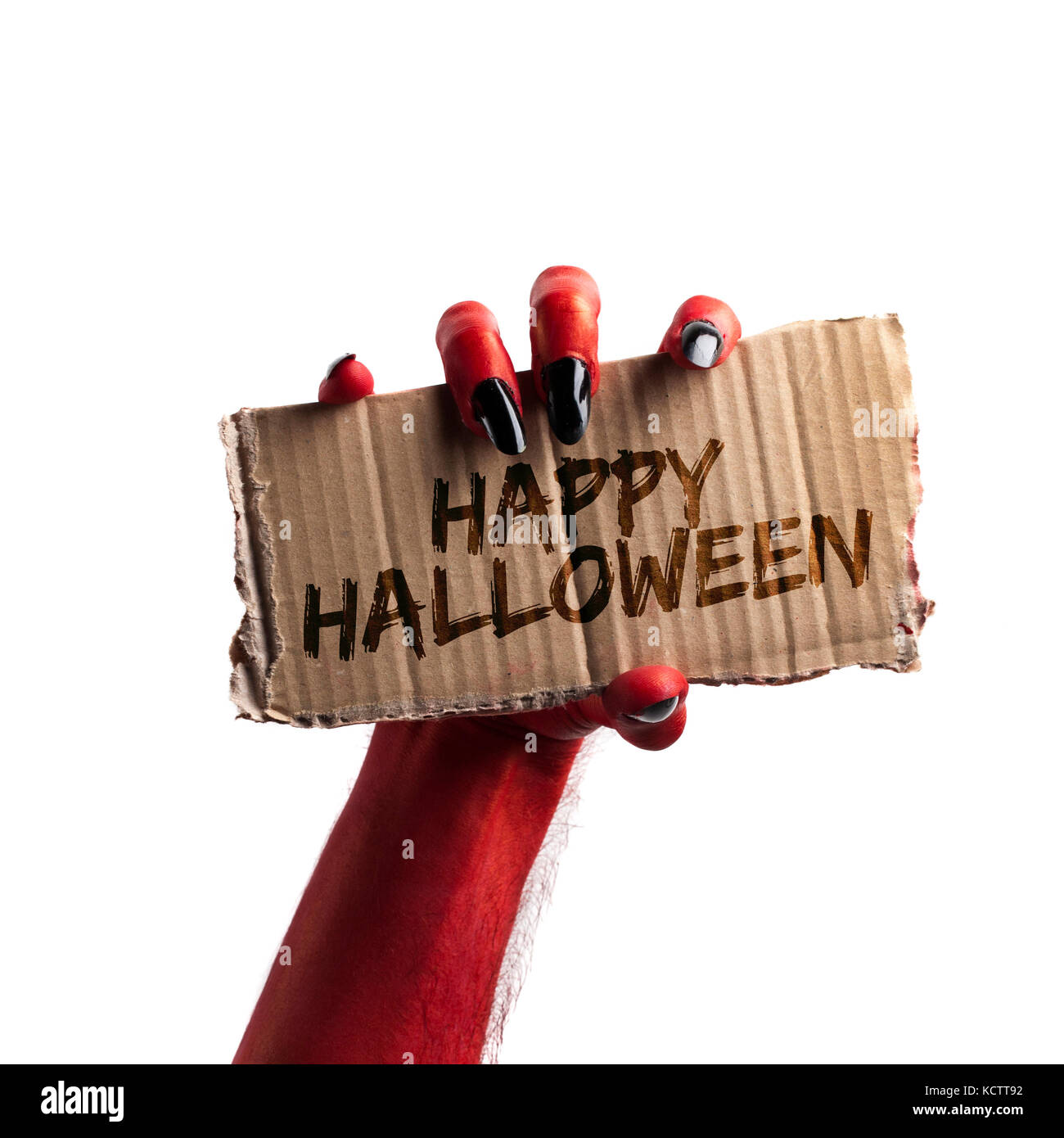 Happy Halloween. diable rouge ou zombie halloween monster hand holding a sign Banque D'Images