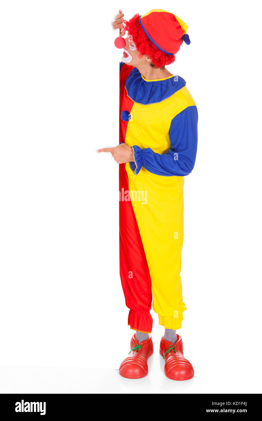 Portrait Of A Happy Joker Holding Blank Placard sur fond blanc Banque D'Images