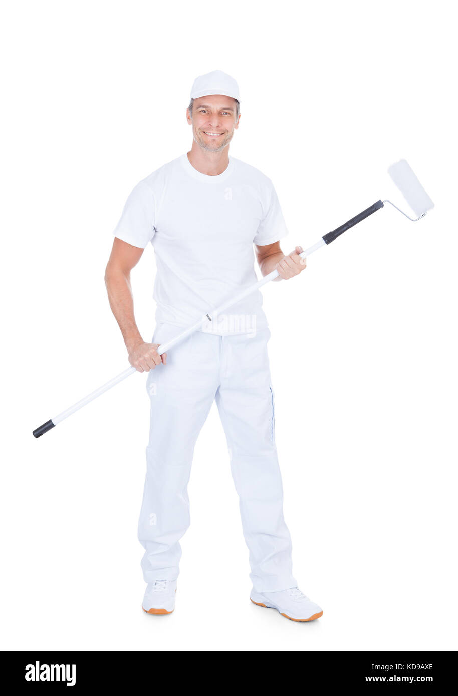 Painter Holding Paint Roller on White Background Banque D'Images