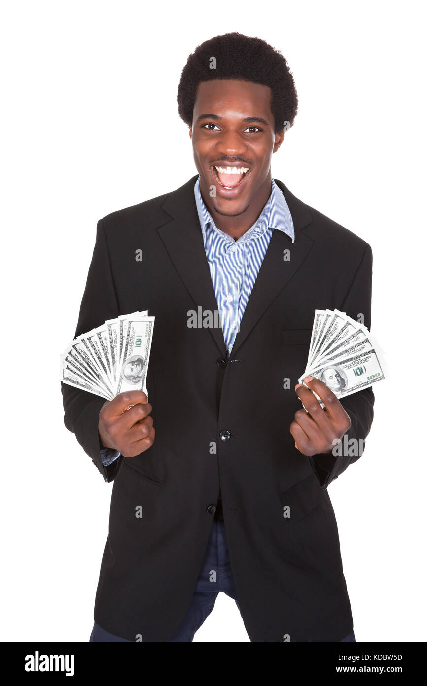 Excited Businessman Holding Devise Dollar isolé sur fond blanc Banque D'Images