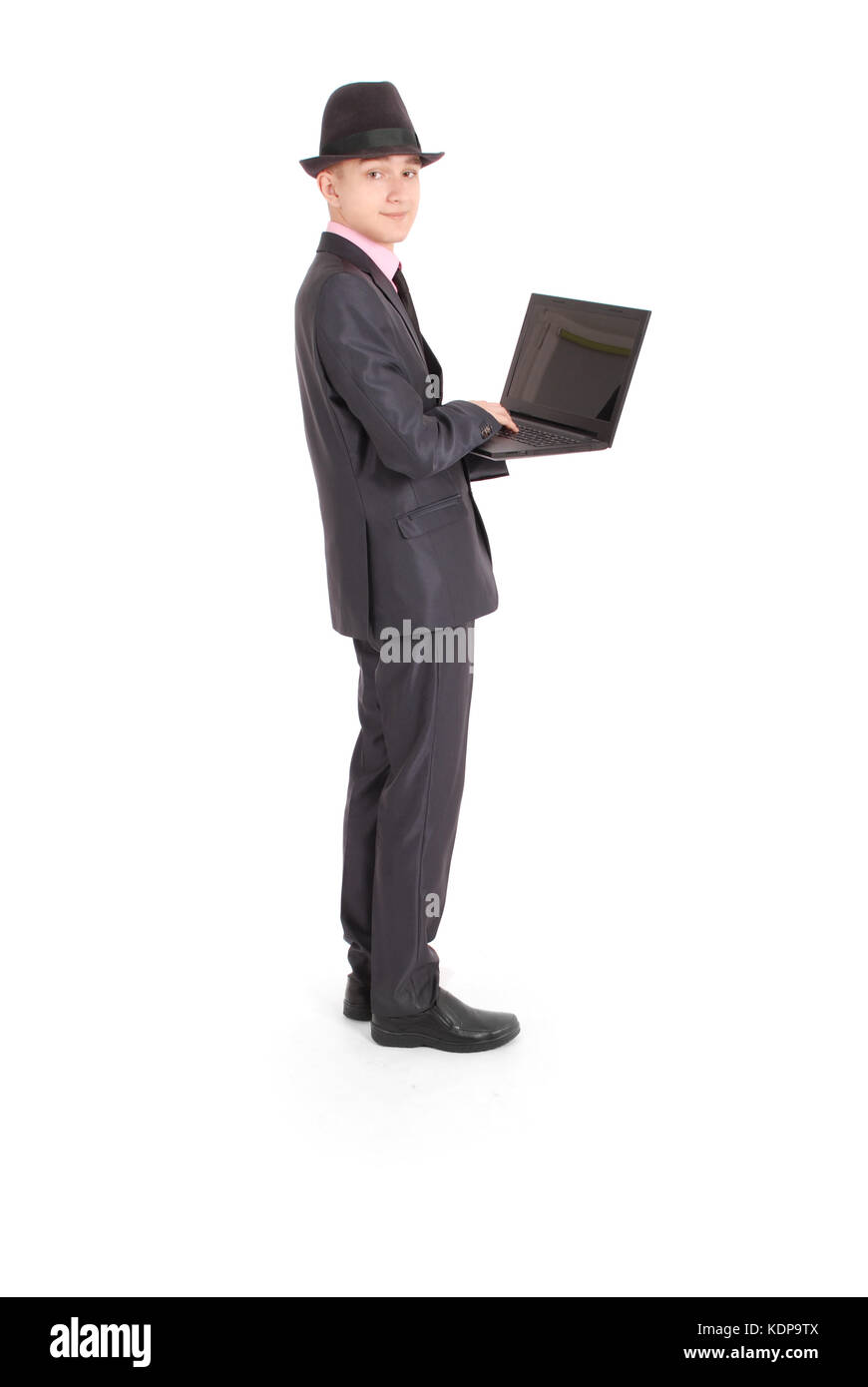 Portrait of confident businesswoman qui working on laptop in formals isolés sur fond blanc Banque D'Images