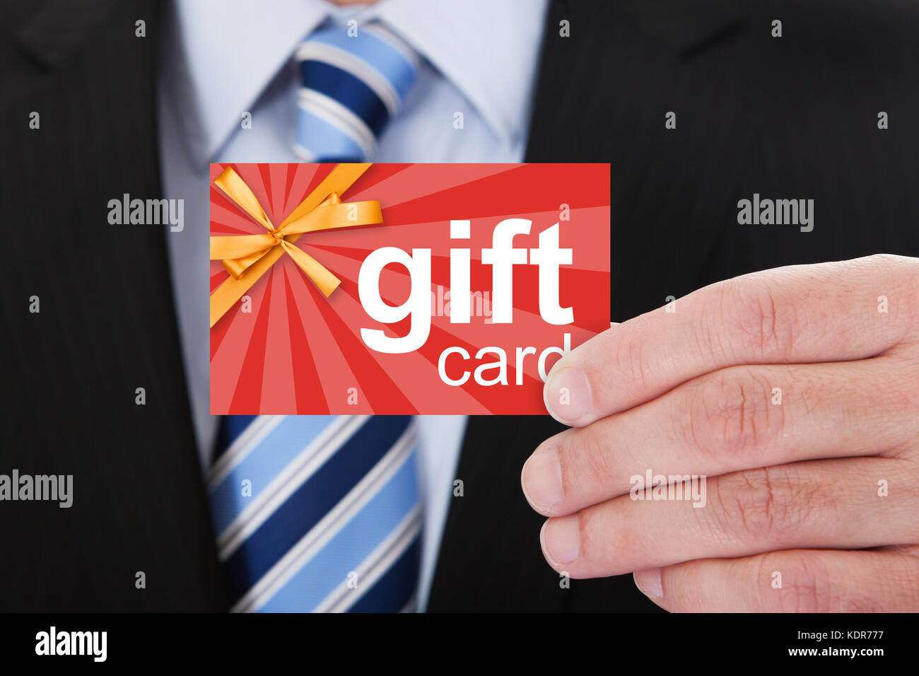 Close-up of businessman holding gift card Banque D'Images