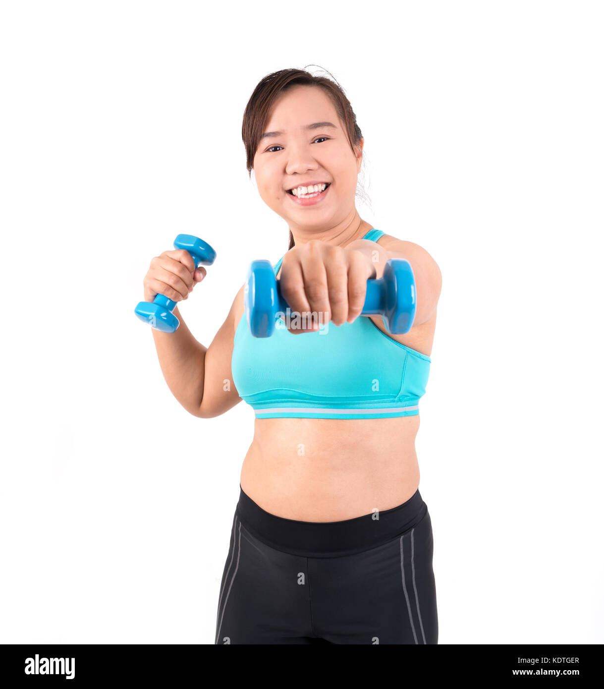 Asian chubby woman holding dumbbell pour l'exercice Banque D'Images