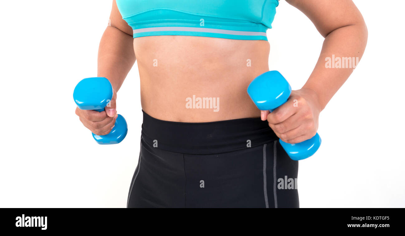 Asian chubby woman holding dumbbell pour l'exercice Banque D'Images