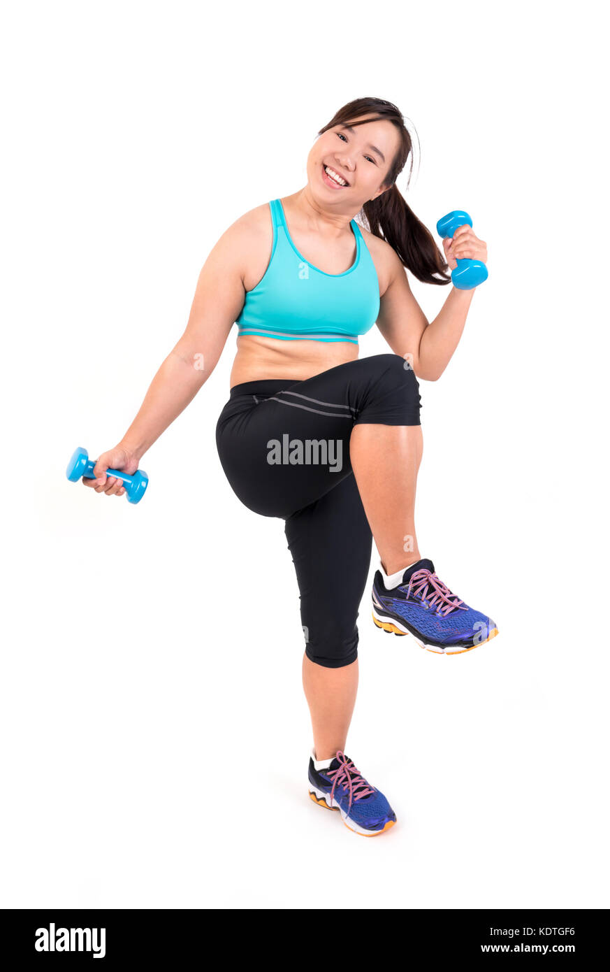 Asian chubby woman holding dumbbell pour l'exercice Banque D'Images Asian chubby woman holding dumbbell pour l'exercice Banque D'Images