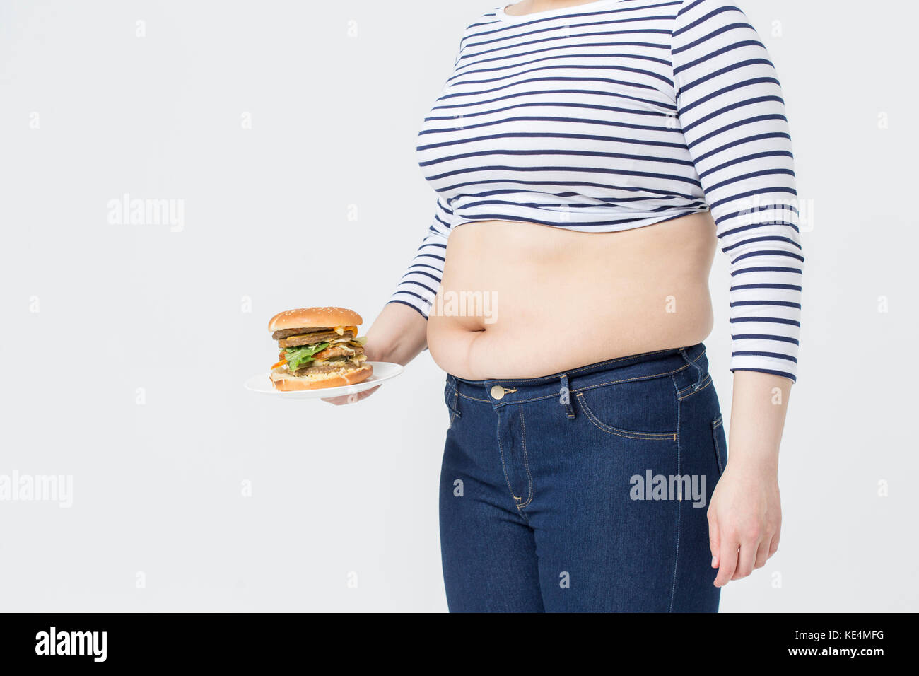 Fat Woman holding fast-food Banque D'Images