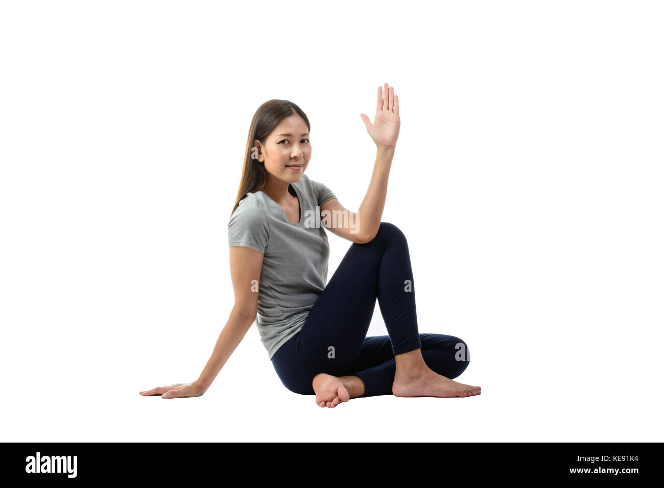 Young Asian woman practicing yoga, assis en pose facile , femme en bonne santé. concept de bonne hygiène de vie et de détente. man isolalted,studi Banque D'Images
