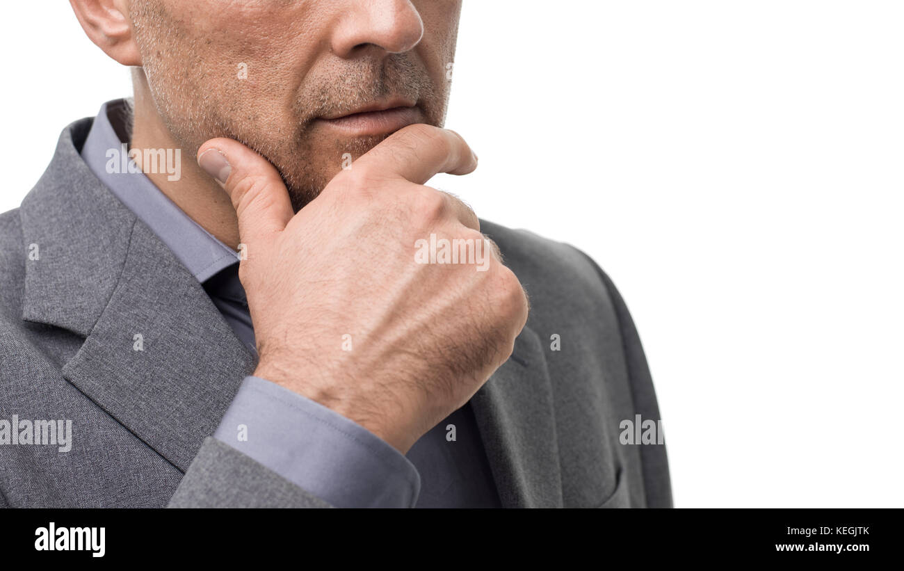 Pensive businessman with hand on chin : stratégies d'entreprise, opportunités et défis Banque D'Images Pensive businessman with hand on chin : stratégies d'entreprise, opportunités et défis Banque D'Images