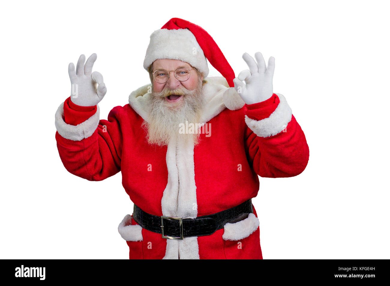 Santa montrant ok sign, fond blanc. Le père Noël joyeux faire okey signer avec les deux mains sur fond blanc. Banque D'Images