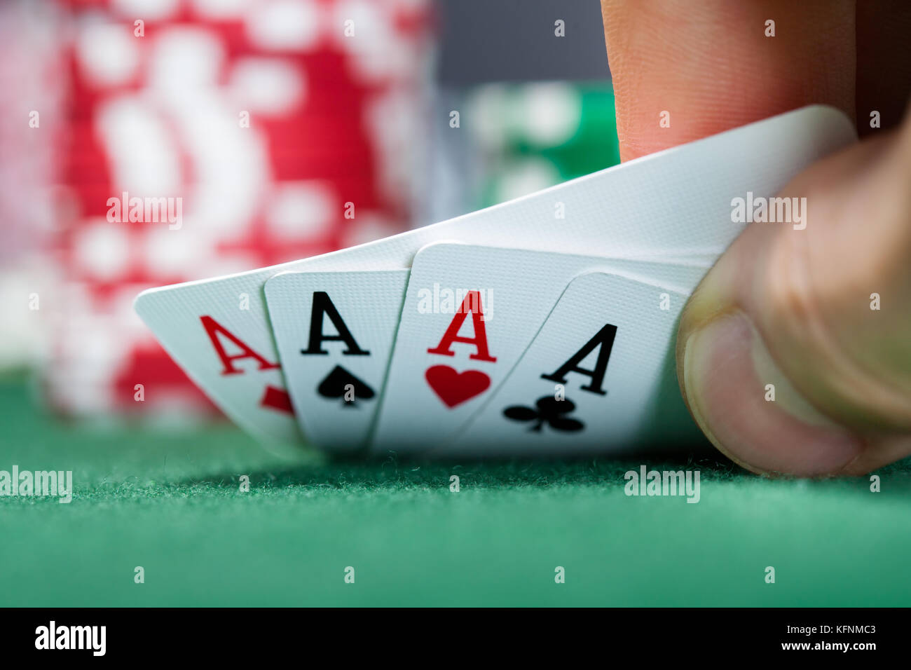 Close-up of a poker player holding playing cards Banque D'Images