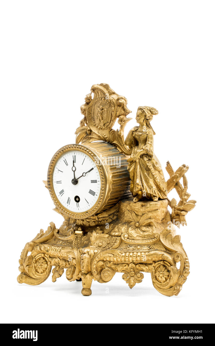 Table d'or antique horloge sur le fond blanc. Banque D'Images