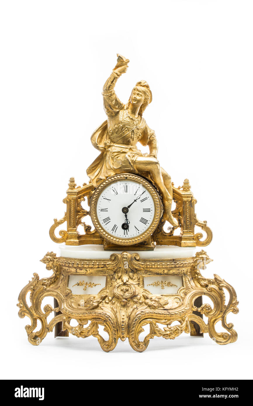 Table d'or antique horloge sur le fond blanc. Banque D'Images