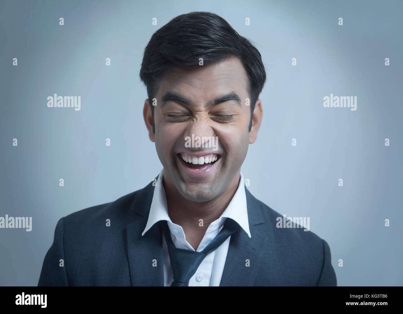 Young businessman making face Banque D'Images