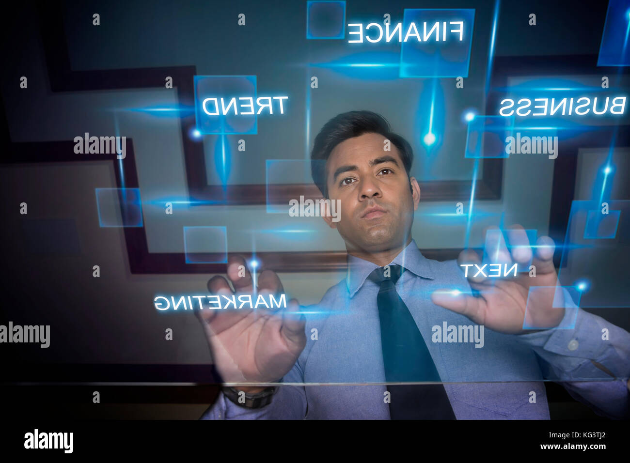 Businessman using futuristic computer keyboard Banque D'Images