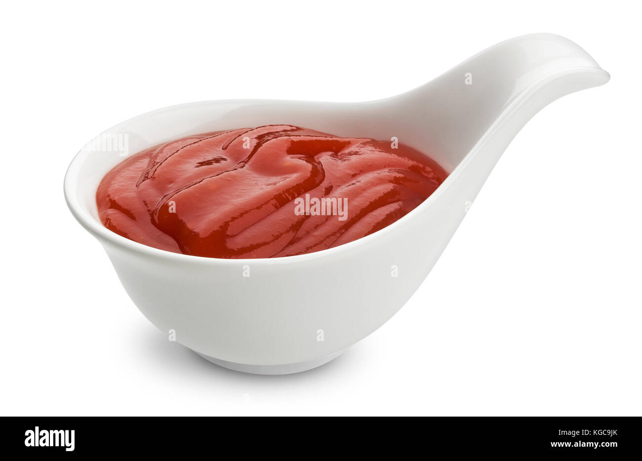 Le ketchup isolé sur fond blanc, de la sauce tomate dans un bol Banque D'Images