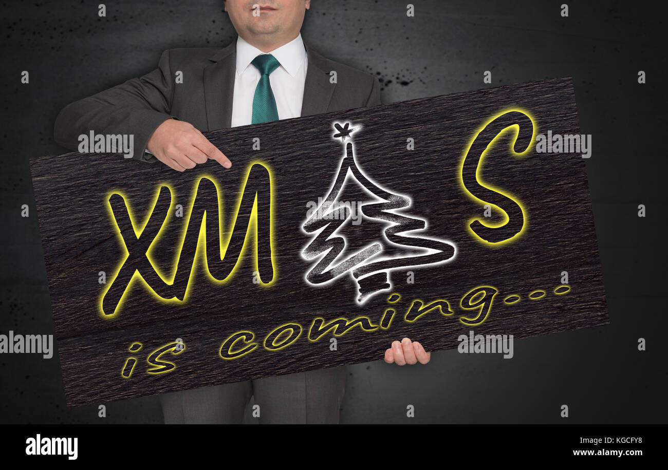 L'affiche de Noël est organisé par l'homme d'affaires. Banque D'Images