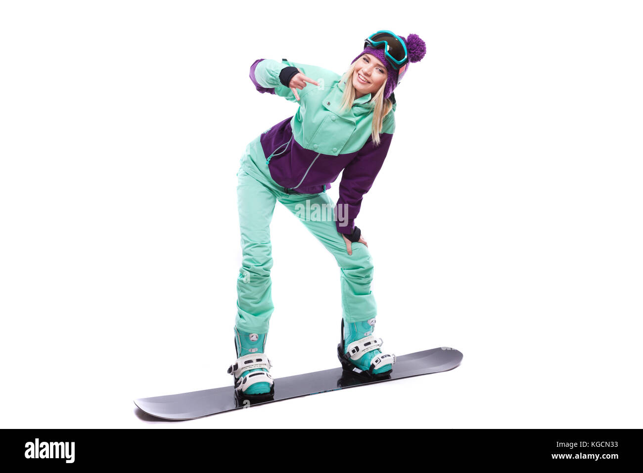 Jolie jeune femme en costume de ski snowboard ride violet Photo Stock -  Alamy