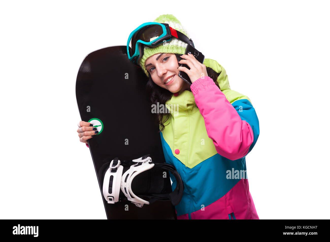 Belle jeune femme en tenue de ski et snowboard en attente Banque D'Images