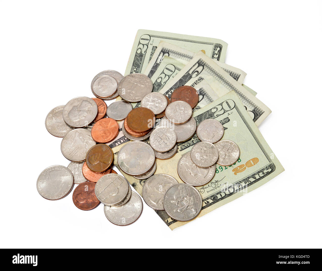 Coup horizontal de se déploient en 5 et 20 dollars avec un tas de pièces de monnaie sur le dessus d'eux sur un fond blanc. Banque D'Images