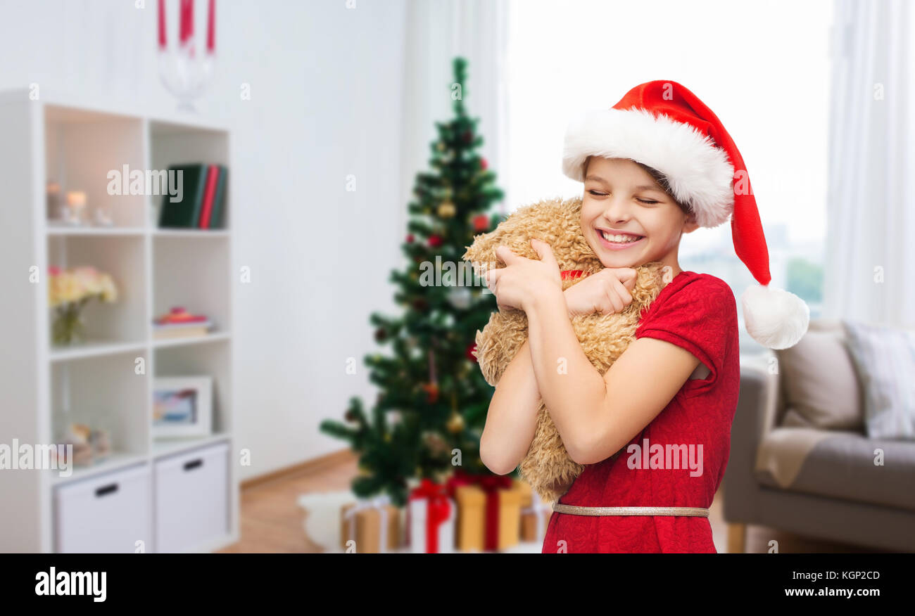 Happy girl with teddy bear à Noël Banque D'Images