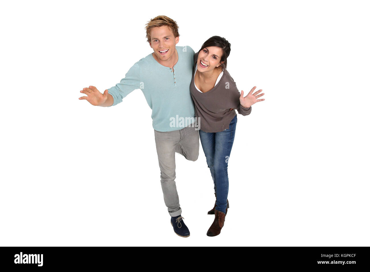 Cheerful couple sur fond blanc outloud rire Banque D'Images