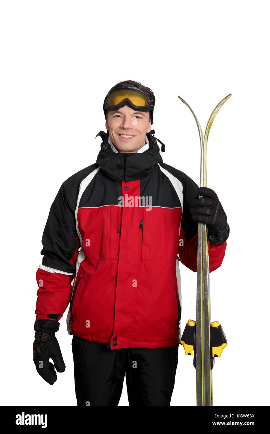 L'homme en tenue de ski debout sur fond blanc Photo Stock - Alamy