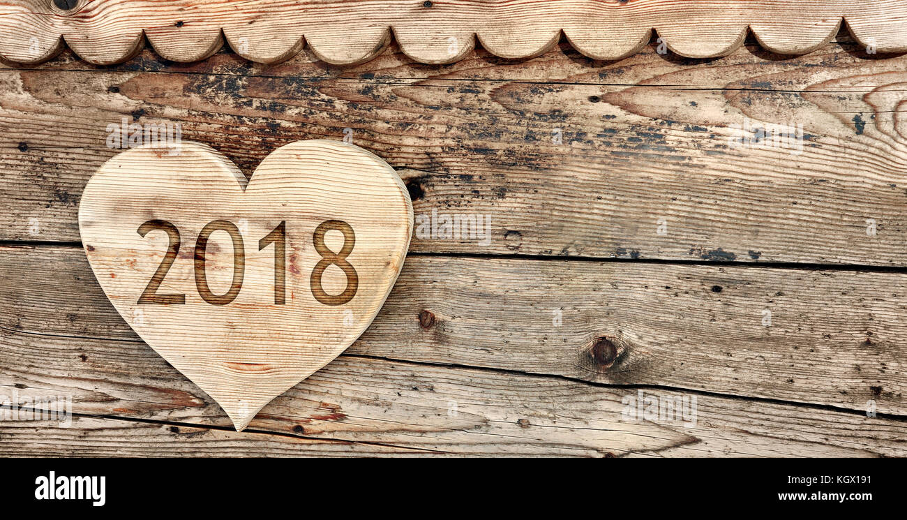 2018 écrit sur un sol en bois en forme de coeur sur fond de bois Banque D'Images
