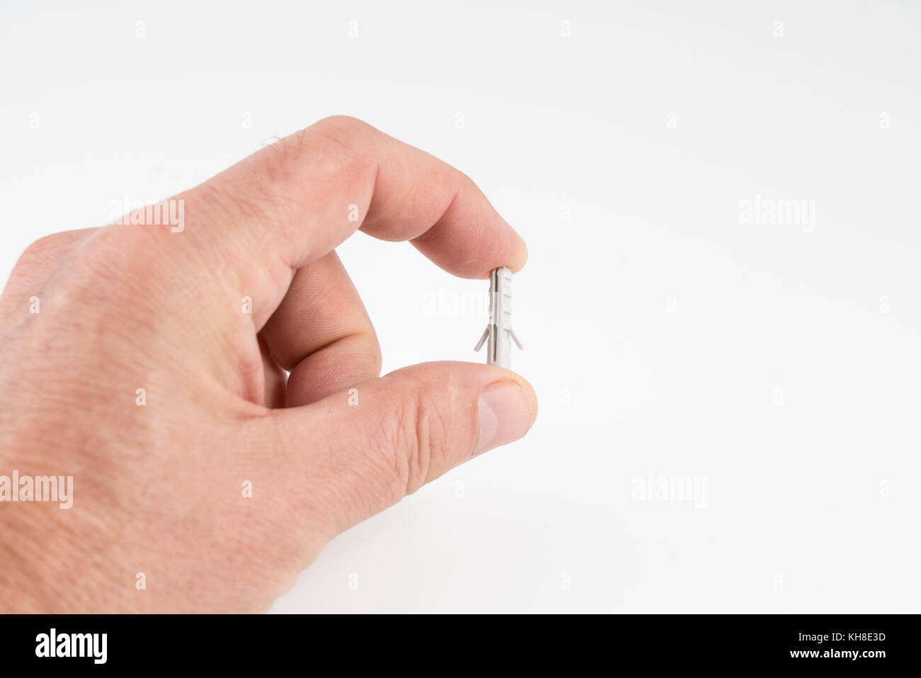 Quelques prises murales en plastique sur la main Banque D'Images