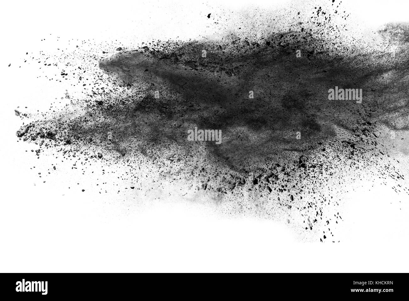 Résumé d'explosion de poussière noire sur fond blanc. Banque D'Images