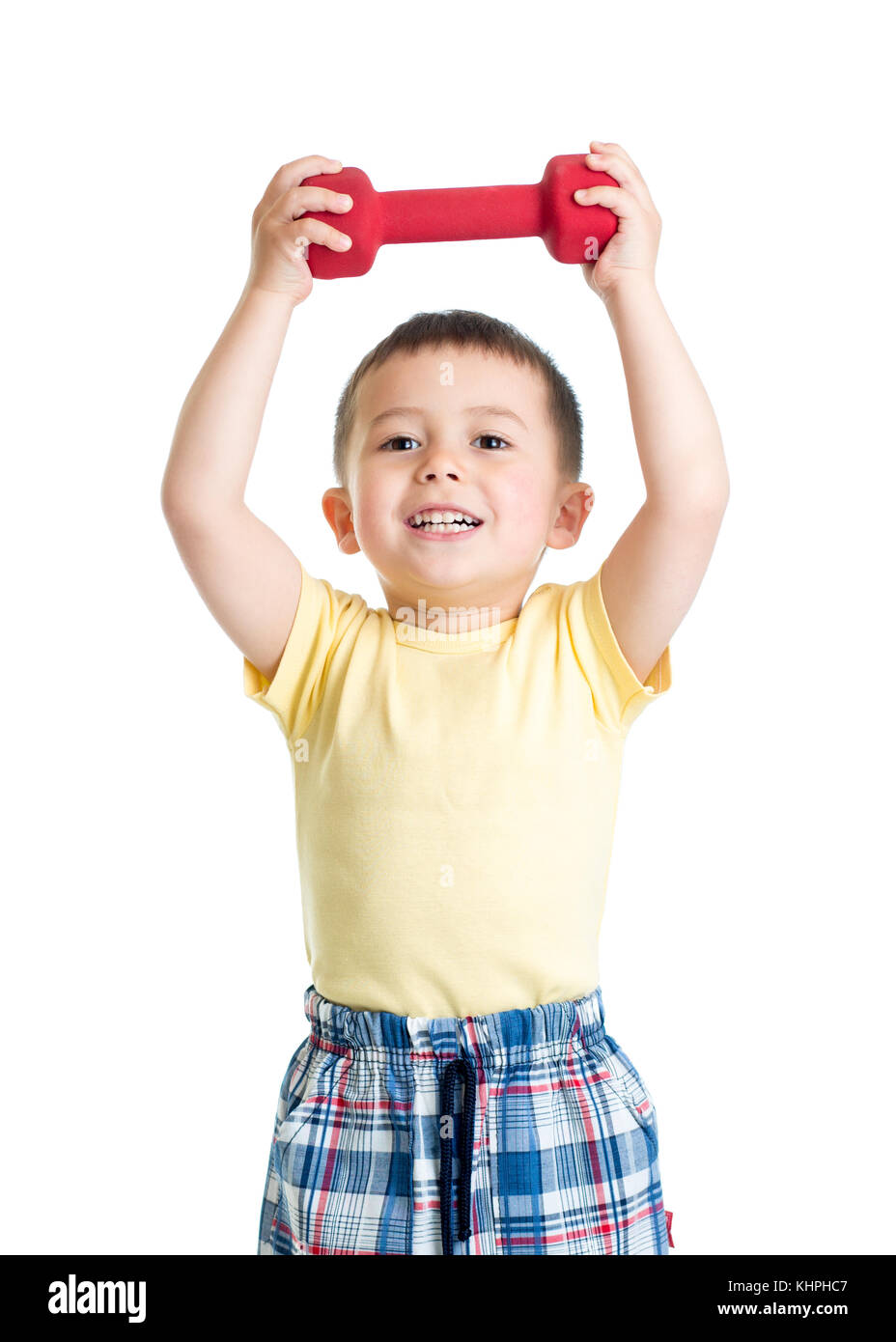 Enfant Garçon est engagé dans l'entraînement physique avec haltère rouge Banque D'Images