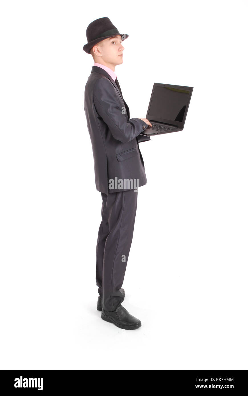 Portrait of confident businesswoman qui working on laptop in formals isolés sur fond blanc Banque D'Images