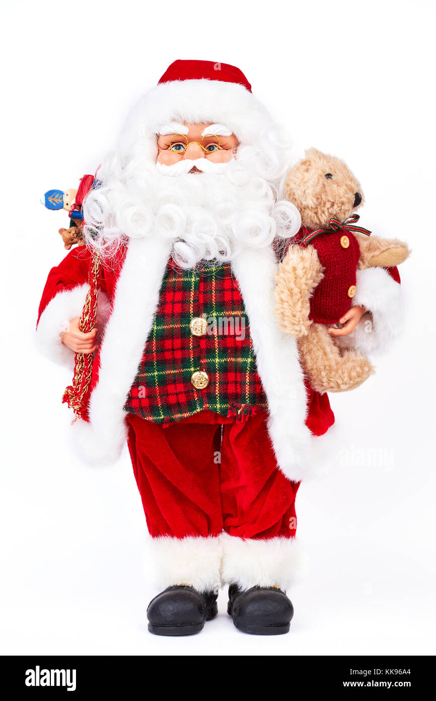 Jolie poupée père Noël avec des cadeaux. Banque D'Images