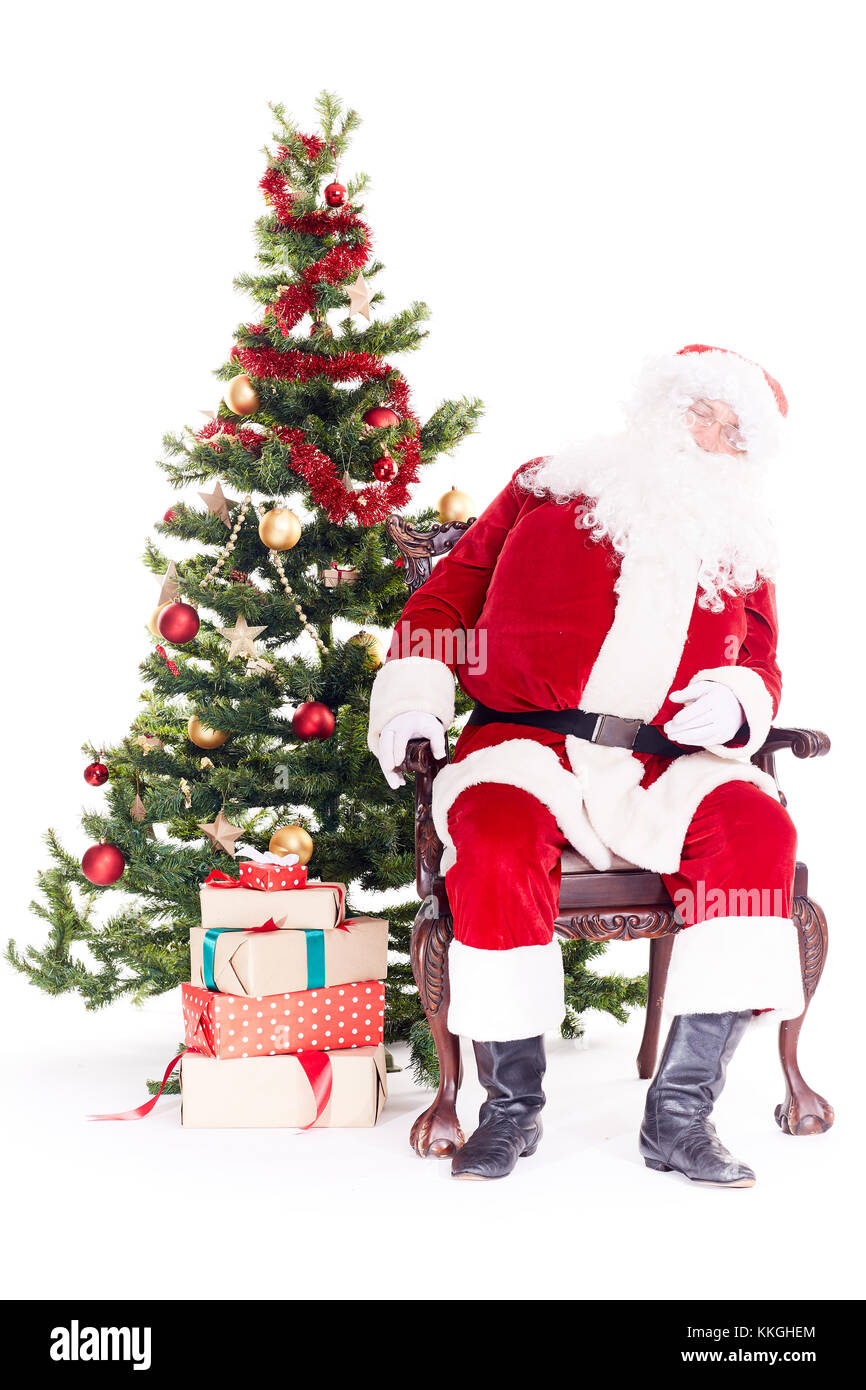 Santa dormir près de l'arbre de Noël Banque D'Images