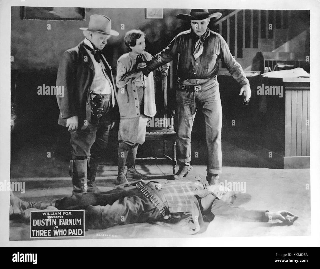 Une carte de lobby pour "Three Who Paid", un film occidental muet, utilisé à des fins promotionnelles dans les salles pour faire la publicité du film. Banque D'Images