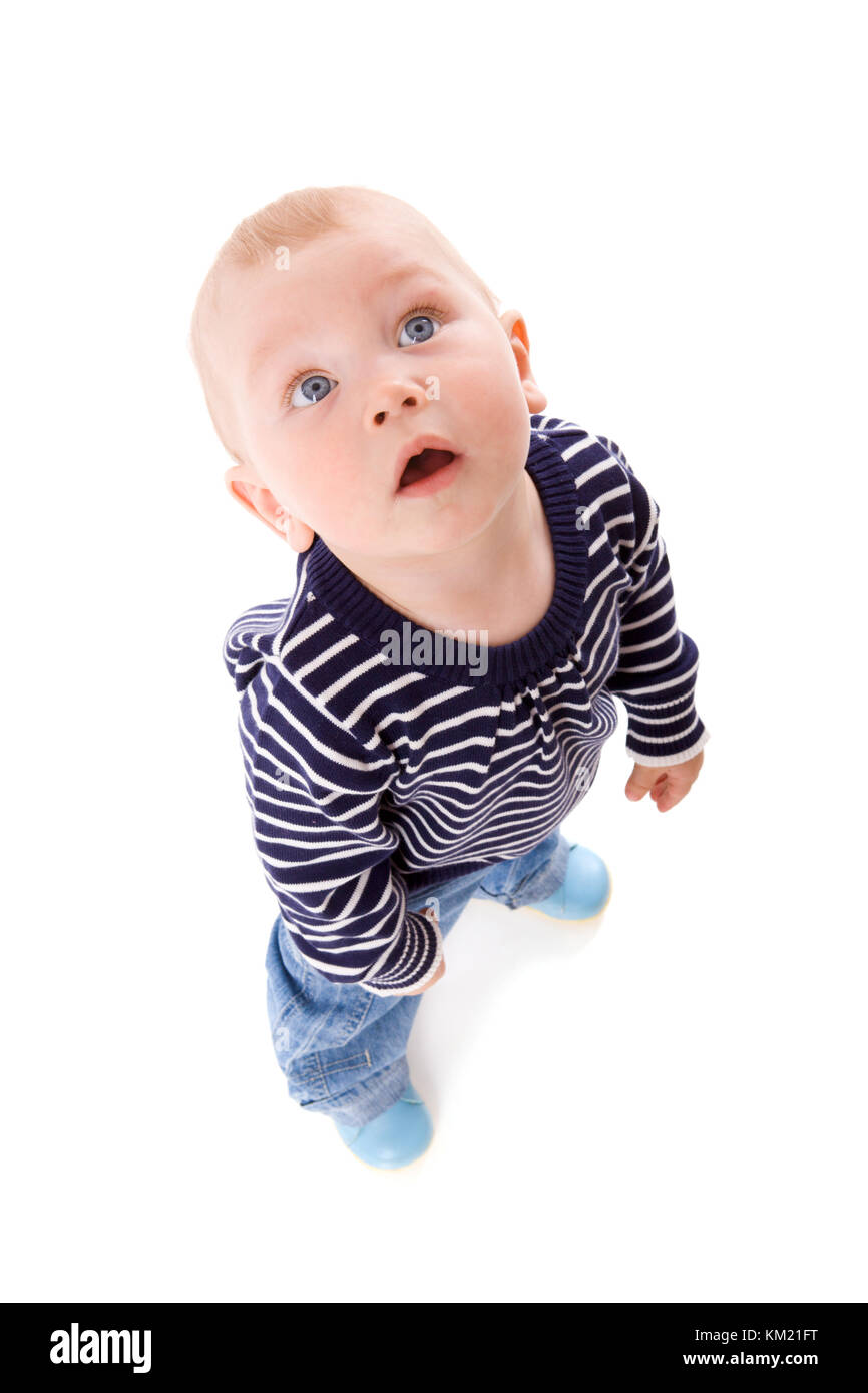 Funny Boy looking up un an isolated on white Banque D'Images