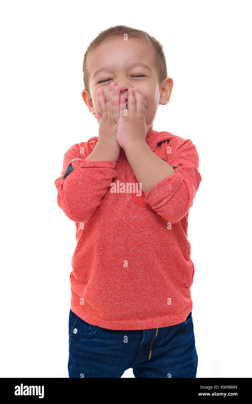 Jeune enfant heureux de rire sur fond blanc Banque D'Images