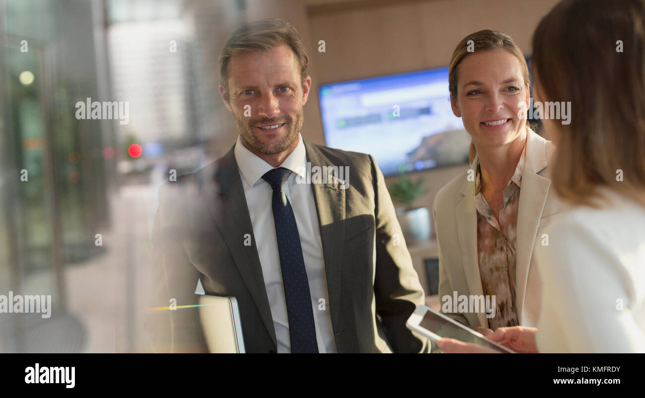 Portrait smiling businessman with Businesswomen in office Banque D'Images