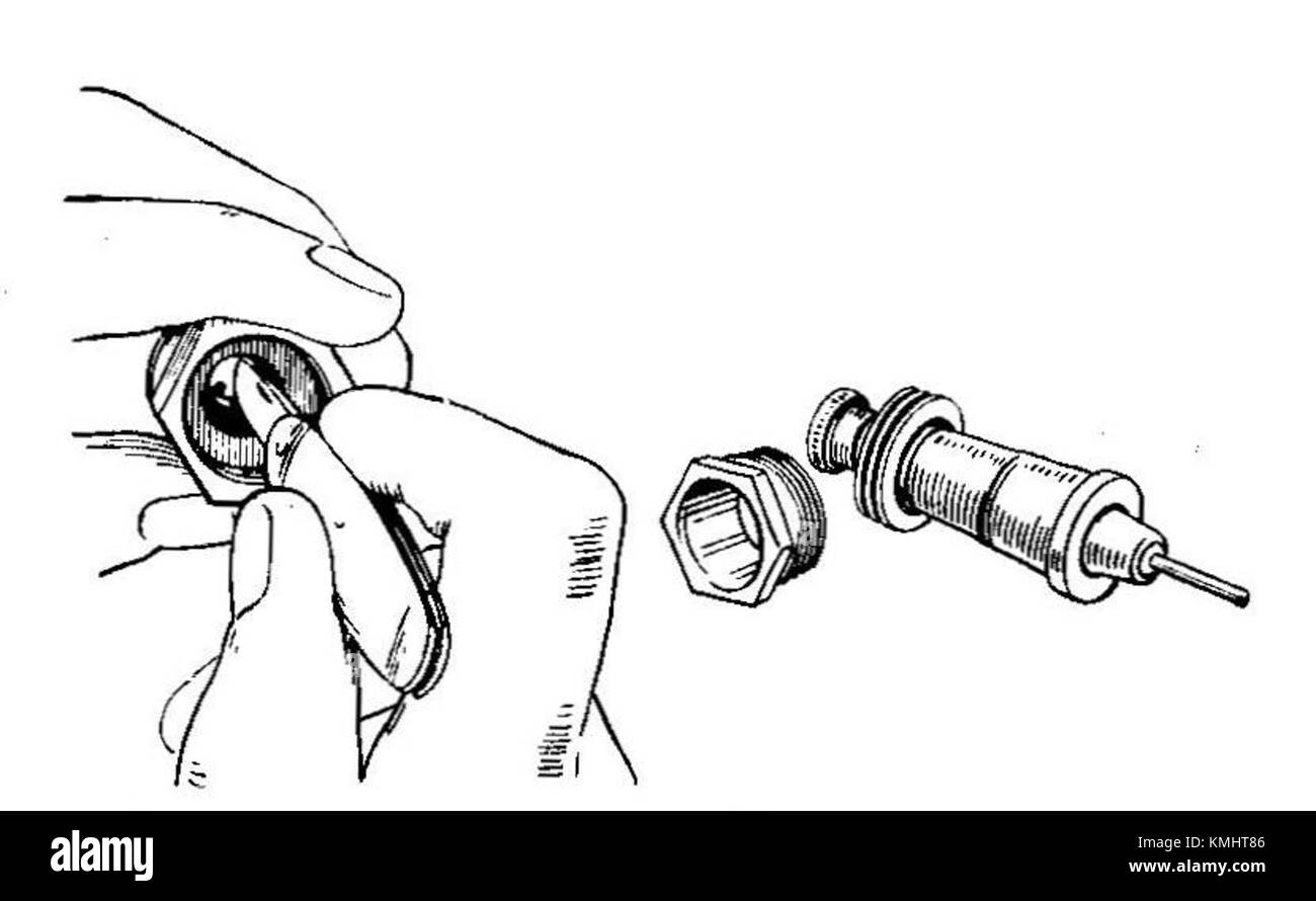 Une illustration tirée du manuel des autocars de 1935, représentant une bougie KLG démontée pour être nettoyée, donnant un aperçu des pratiques d'entretien automobile du début du XXe siècle. Banque D'Images
