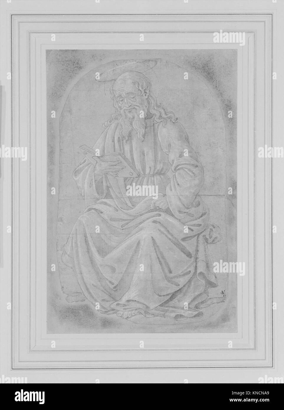 Cette sculpture médiévale montre un saint assis lisant, représentant l'art religieux et la compétence sculpturale de l'époque. Banque D'Images