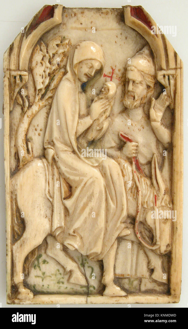 Ce fragment de panneau français du XIVe siècle représente la fuite en Égypte et est fabriqué à partir d'ivoire d'éléphant avec une décoration polychrome. Banque D'Images