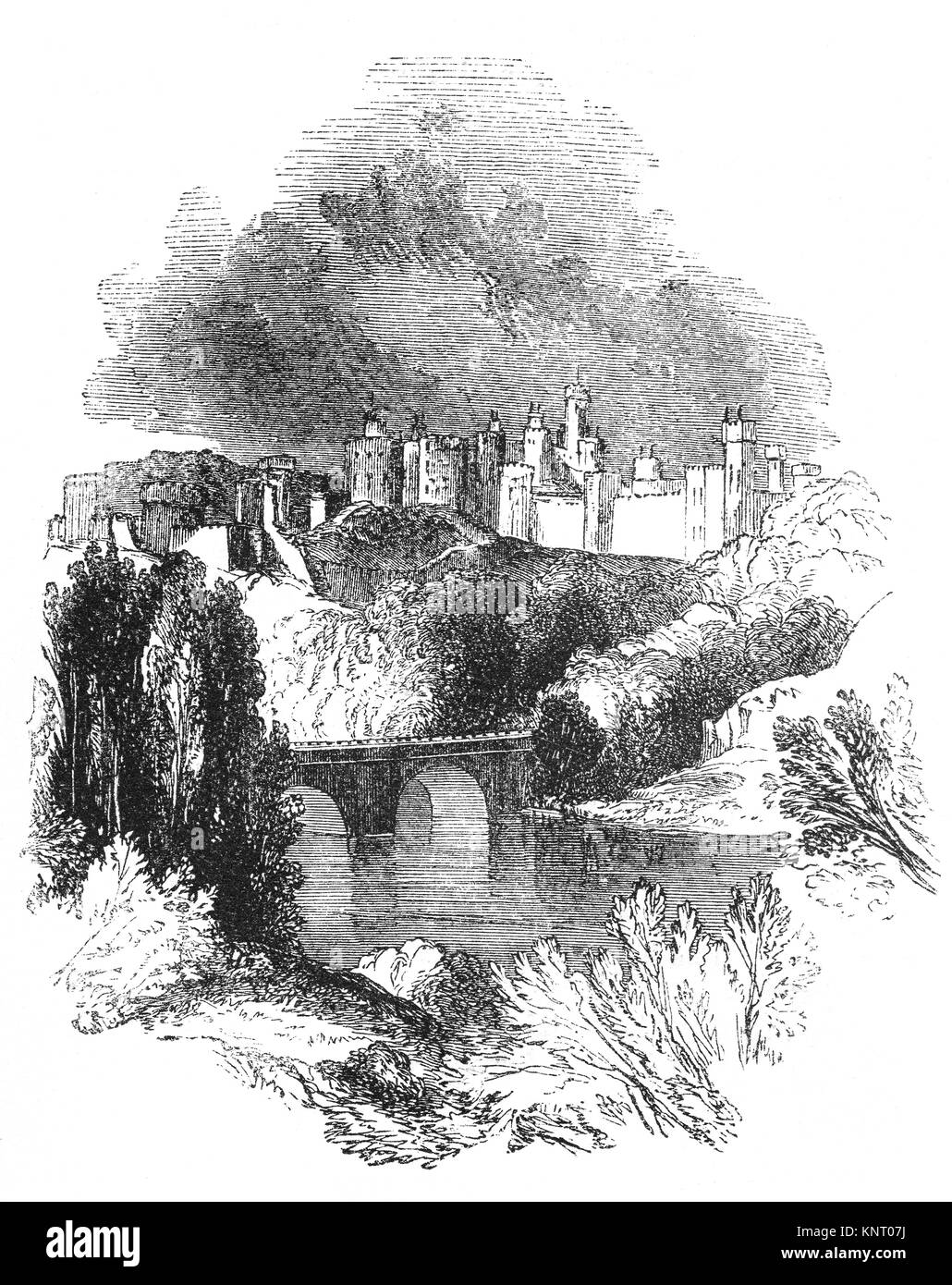 Château d'Alnwick au-dessus du pont traversant la rivière Aln dans le Northumberland, en Angleterre. Le château a été fondé à la fin du xie siècle par Ivo de Vesci, un gentilhomme normand de Vassy, Calvados en Normandie. Banque D'Images