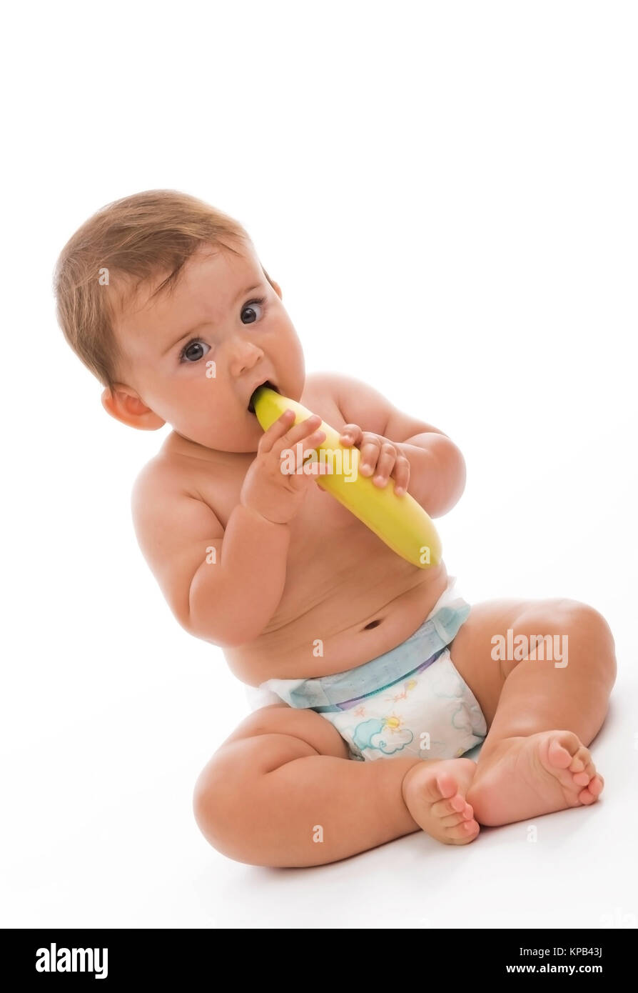 Communiqué de modèle, Kleinkind dans Windeln mit Banane in der Hand - petit enfant avec banane Banque D'Images