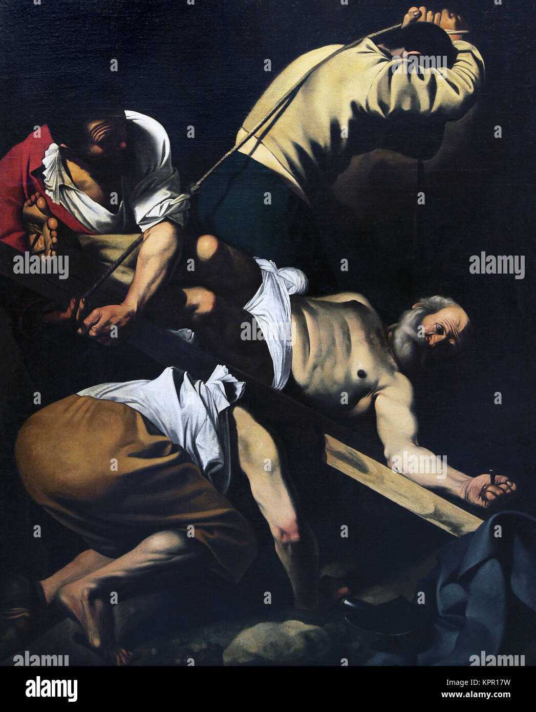 Crucifixion de saint Pierre / Crucifixion de San Pedro par Michelangelo Merisi da Caravaggio.Julienne Latium Ligurie Lombardie Marches Molise peintre italien du 17ème siècle.Peinture Banque D'Images