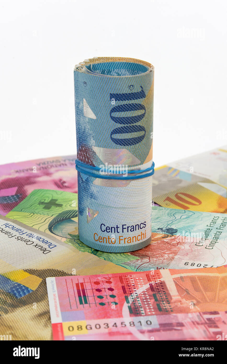 Billets de 100 franc suisse roula avec caoutchouc Banque D'Images
