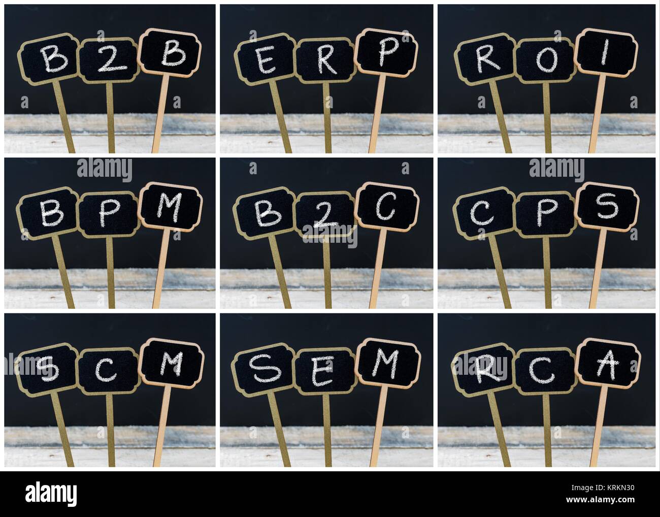 Collage Photo d'affaires acronymes écrit avec la craie sur tableau noir en bois mini étiquettes Banque D'Images